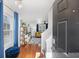 Inviting entryway features hardwood floors and a view into the stylish living room at 3506 Galaxy Rd, Ladson, SC 29456