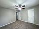 Cozy bedroom featuring plush carpet flooring, a ceiling fan with lighting, neutral paint and two doors at 36 Guerry Cir, Goose Creek, SC 29445
