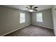 Bedroom featuring plush carpet flooring, a ceiling fan with lighting, neutral paint, and natural light at 36 Guerry Cir, Goose Creek, SC 29445