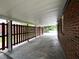 A red brick house with a covered carport and a dark wood fence at 36 Guerry Cir, Goose Creek, SC 29445