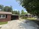 Driveway with a covered carport attached to the brick home at 36 Guerry Cir, Goose Creek, SC 29445