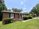 Single-story brick home featuring a covered porch, and classic black shutters at 36 Guerry Cir, Goose Creek, SC 29445