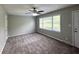Living room featuring plush carpet flooring, a ceiling fan with lighting, neutral paint, and natural light at 36 Guerry Cir, Goose Creek, SC 29445