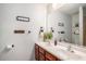 Updated bathroom with double sink vanity, white countertop, stylish decor, and a large mirror at 3813 Battleview Ct, North Charleston, SC 29420