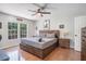 Cozy bedroom with a rustic wood bed frame and natural light at 3813 Battleview Ct, North Charleston, SC 29420