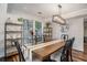 Elegant dining room features hardwood floors, modern lighting, and plenty of natural light at 3813 Battleview Ct, North Charleston, SC 29420