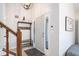 Bright entryway with tile floors, coat rack with bench and staircase with wooden handrail at 3813 Battleview Ct, North Charleston, SC 29420