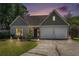 Charming single-Gathering home with a two-car garage and a well-maintained lawn at sunset at 3813 Battleview Ct, North Charleston, SC 29420