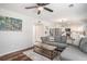 Open living room with gray sectional sofa and view to the kitchen at 3813 Battleview Ct, North Charleston, SC 29420