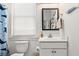 Cozy bathroom featuring a white vanity, toilet, and shark-themed decor at 383 Oak Park St, Summerville, SC 29486