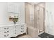 Bright bathroom featuring a tiled glass shower, white vanity, and a window that allows for great natural light at 383 Oak Park St, Summerville, SC 29486
