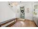 Inviting entryway with a staircase, chandelier, bench, and stylish front door at 383 Oak Park St, Summerville, SC 29486