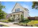 Charming two-story home with a welcoming front porch and beautifully landscaped yard at 383 Oak Park St, Summerville, SC 29486