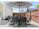 Backyard patio with striped umbrella over outdoor table and seating at 383 Oak Park St, Summerville, SC 29486