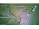 Aerial view of long wooden piers extending into marshland with boats docked at 392 Tombee Ct, Mount Pleasant, SC 29464