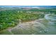 Expansive aerial view of waterfront properties with private docks, ideal for boaters and nature lovers at 392 Tombee Ct, Mount Pleasant, SC 29464