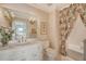 Bright bathroom with a large mirror, vanity, and floral shower curtain at 392 Tombee Ct, Mount Pleasant, SC 29464