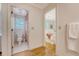 Bright bathroom featuring a white toilet and a shower with a decorative floral curtain, next to the bedroom at 392 Tombee Ct, Mount Pleasant, SC 29464