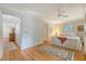 Bedroom with hardwood floors, a ceiling fan, and connects to other rooms in the house at 392 Tombee Ct, Mount Pleasant, SC 29464