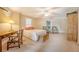 Cozy bedroom featuring neutral tones, a large bed, and sitting area, creating a relaxing retreat at 392 Tombee Ct, Mount Pleasant, SC 29464