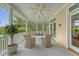 Spacious porch with a charming swing and comfortable seating perfect for enjoying the outdoors at 392 Tombee Ct, Mount Pleasant, SC 29464