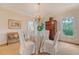 Elegant dining room with a round table, chandelier, and traditional wood accents at 392 Tombee Ct, Mount Pleasant, SC 29464