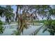 Picturesque view of the community docks on the water, framed by mature trees with Spanish moss at 392 Tombee Ct, Mount Pleasant, SC 29464