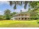 Charming two-story home with a spacious front porch and mature landscaping, offering curb appeal at 392 Tombee Ct, Mount Pleasant, SC 29464