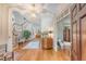 Bright and spacious foyer with hardwood floors, staircase, and views into the adjacent rooms at 392 Tombee Ct, Mount Pleasant, SC 29464