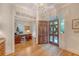 Welcoming foyer with hardwood flooring and a view into a study, featuring natural light at 392 Tombee Ct, Mount Pleasant, SC 29464