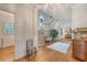 Inviting foyer with hardwood floors, curved staircase, and elegant decor create a warm welcome at 392 Tombee Ct, Mount Pleasant, SC 29464