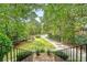 Inviting front yard view from the top of the brick stairs, featuring lush landscaping and a long driveway at 392 Tombee Ct, Mount Pleasant, SC 29464