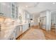 Bright kitchen with white cabinetry, stainless appliances, and wood flooring at 392 Tombee Ct, Mount Pleasant, SC 29464