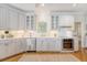 Classic white kitchen with stainless steel appliances and ample counter space at 392 Tombee Ct, Mount Pleasant, SC 29464