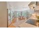 Bright, open kitchen flowing into dining area, featuring stainless steel appliances and hardwood floors at 392 Tombee Ct, Mount Pleasant, SC 29464
