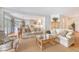Comfortable living room with neutral tones and adjoined eat-in kitchen at 392 Tombee Ct, Mount Pleasant, SC 29464