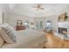 Spacious main bedroom with hardwood floors, fireplace, and access to outdoor balcony at 392 Tombee Ct, Mount Pleasant, SC 29464