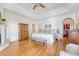 Bright, large main bedroom featuring hardwood floors, trey ceilings, and an ensuite bathroom with walk-in closet at 392 Tombee Ct, Mount Pleasant, SC 29464