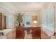 Elegant office with a rich wood desk, plantation shutters, and ample natural light at 392 Tombee Ct, Mount Pleasant, SC 29464