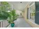 Covered porch featuring a large potted plant and a yellow exterior at 392 Tombee Ct, Mount Pleasant, SC 29464