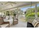 Relaxing porch with wicker furniture and views of the waterfront at 392 Tombee Ct, Mount Pleasant, SC 29464