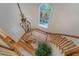 Aerial view of a curved staircase with a decorative chandelier and window at 392 Tombee Ct, Mount Pleasant, SC 29464