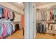 Well-organized walk-in closet with ample hanging space and storage shelving at 392 Tombee Ct, Mount Pleasant, SC 29464