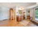 Charming wet bar area with wood cabinetry, stylish decor, and convenient access to the outdoors at 392 Tombee Ct, Mount Pleasant, SC 29464