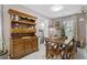 Cozy dining room with vintage hutch, wooden table with bench seating, and neutral color palette at 401 Amy Dr, Goose Creek, SC 29445