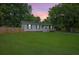 Charming single-story home features a well-maintained lawn, privacy fence, and inviting front porch at 401 Amy Dr, Goose Creek, SC 29445
