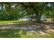 Charming single-story home with a well-manicured lawn and mature trees at 401 Amy Dr, Goose Creek, SC 29445