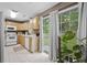 Bright kitchen with light wood cabinets, modern appliances, and a sliding glass door to the patio at 401 Amy Dr, Goose Creek, SC 29445