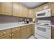 Well-equipped kitchen featuring light wood cabinets, white appliances, and ample counter space at 401 Amy Dr, Goose Creek, SC 29445