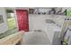 Functional laundry room with washer, dryer, and shelving for storage at 401 Amy Dr, Goose Creek, SC 29445